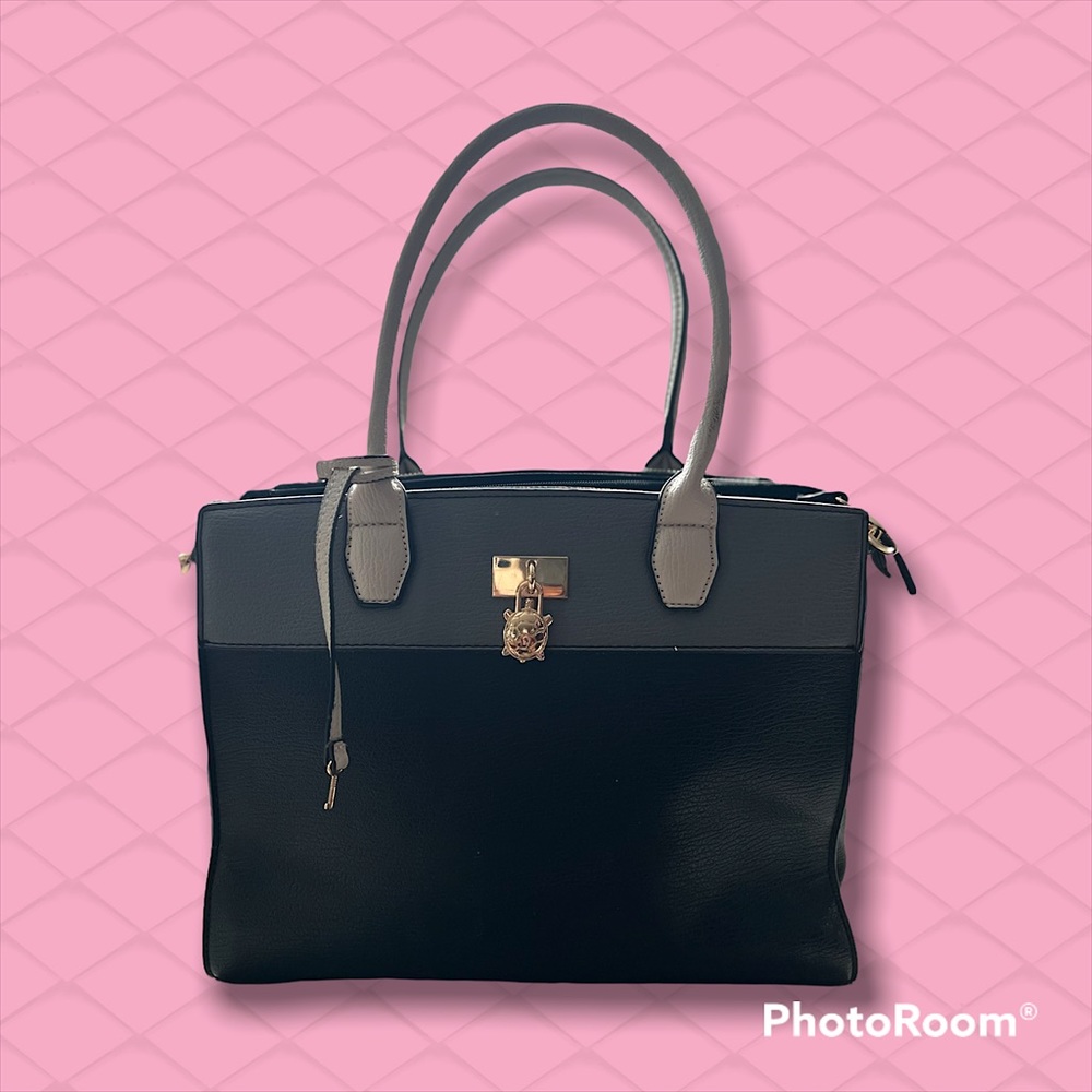 Medium sized shoulder bag by Carpisa. Colors are Black, grey, and off white.